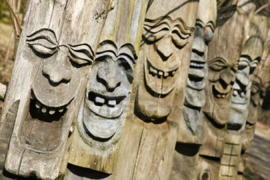 4556721-happy-laughing-faces-carved-out-of-wood